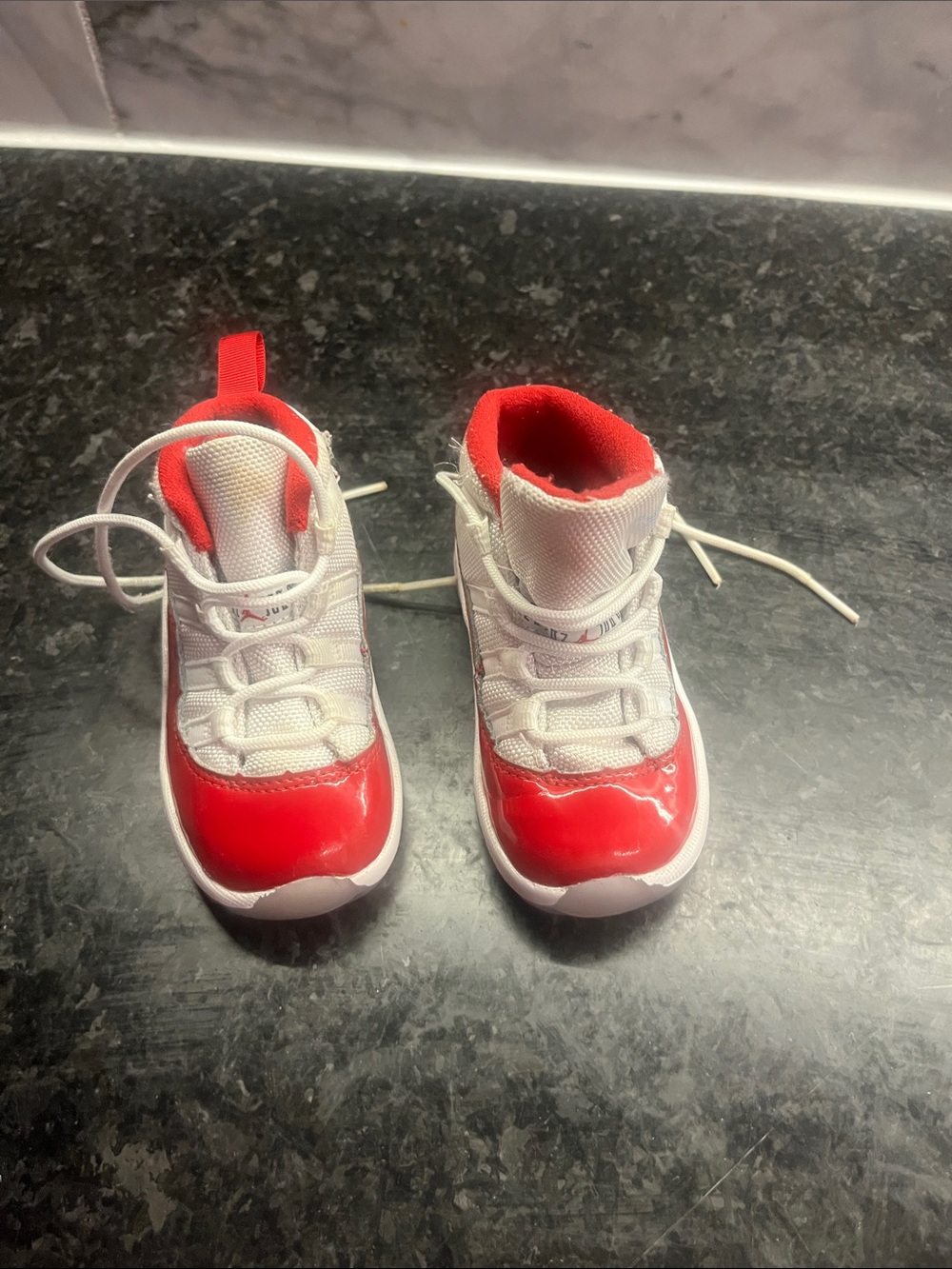Kids Nike Jordons Red and White Athletic Sneakers